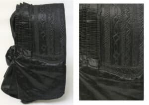 Black satin sloopkappie quilted by machine with geometrical patterns, worn by Mrs. J.M.S.D. Venter in the Bethulie concentration camp.