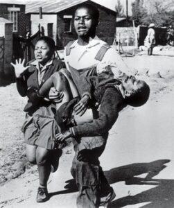 Mbuyisa Makhubo carrying Hector with sister Antoinette on left